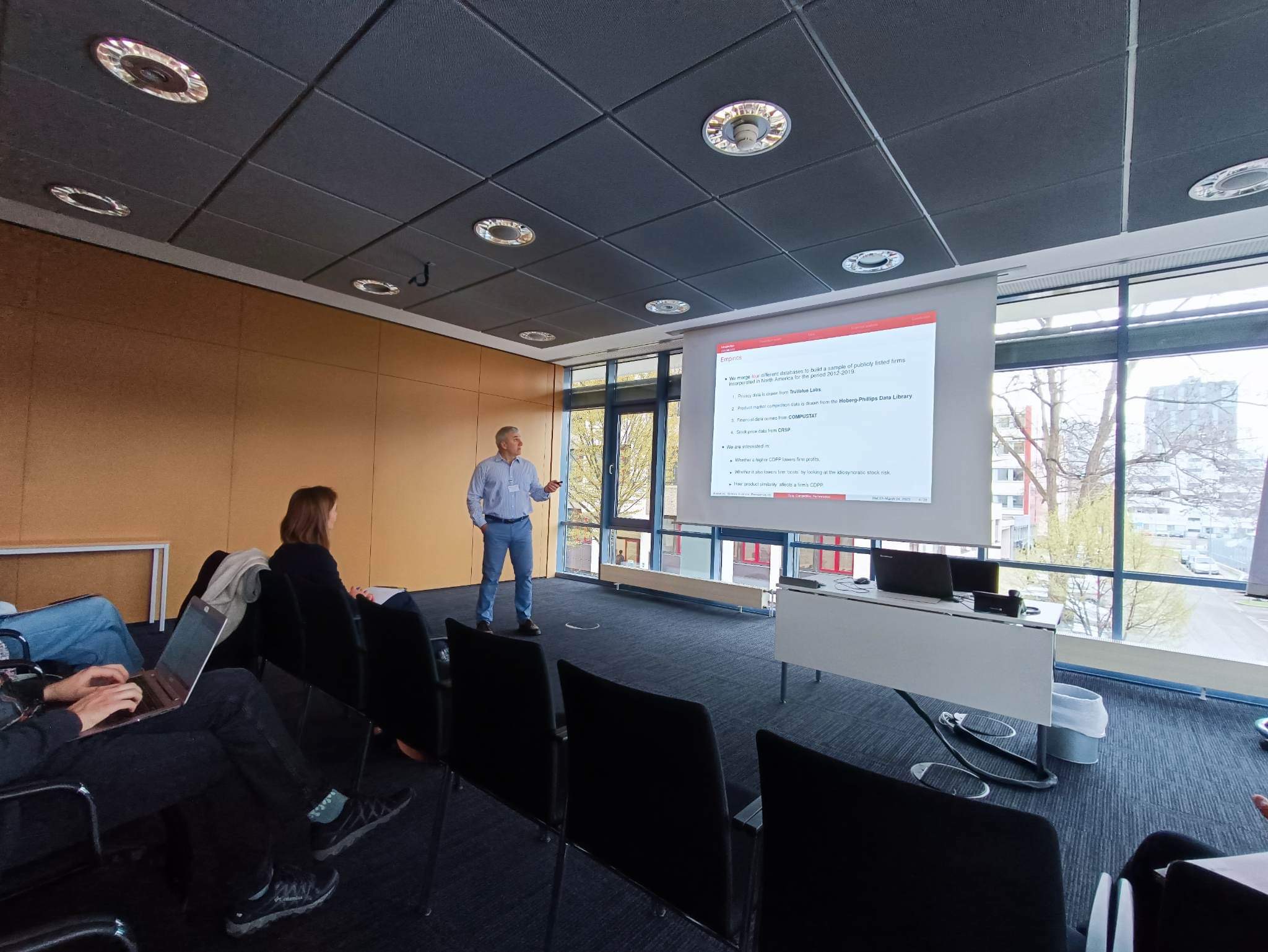 Presenting a paper at the Annual Conference of the Mannheim Centre for Competition and Innovation (MaCCI), Mannheim, Germany, 2023.